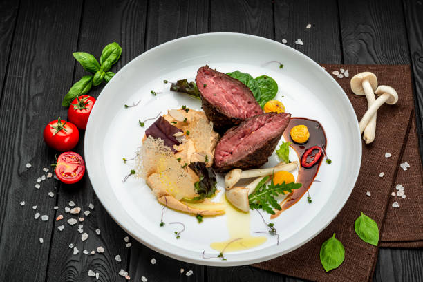 istock Veal medallion with salad and hummus hummus 1399179386