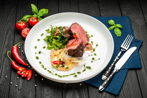 istock Veal medallion with salad and hummus hummus 1399179434