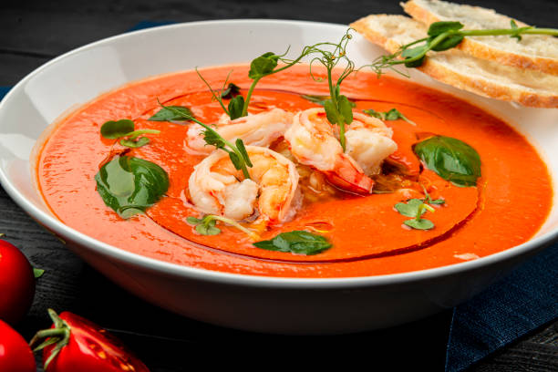 istock Delicious cold tomato soup or gazpacho with shrimps. 1399179437