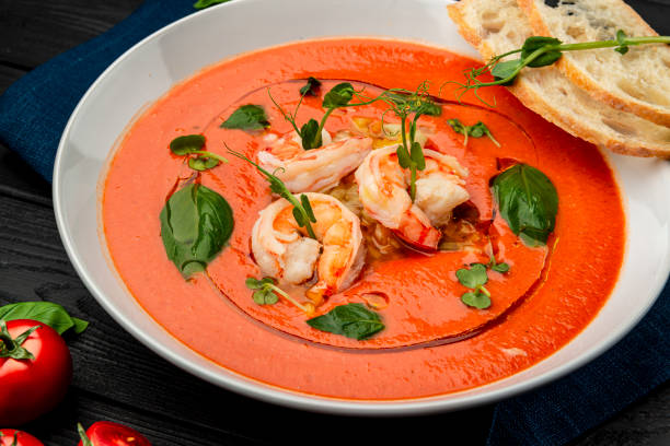 istock Delicious cold tomato soup or gazpacho with shrimps. 1399179438