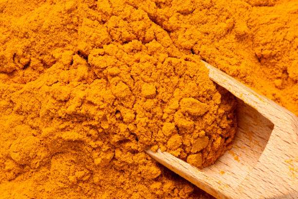 istock Ground turmeric with wooden spoon from above. 1399183080