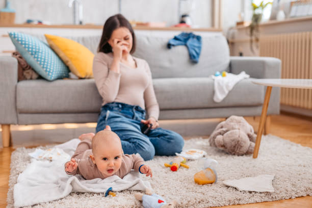 istock Young Tired Mother With Her Newborn 1399186209