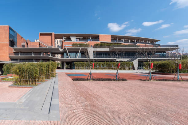 istock Square and greening of modern buildings with red bricks 1399188175