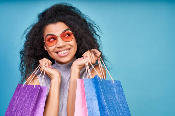 istock Nice curly haired woman enjoying shopping. 1399188826