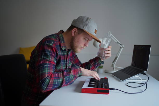 istock Musician composer recording a piece by piano at home studio 1399188889