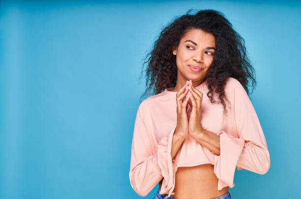 istock The dark-skinned young lady has something to do and looks away. 1399191402