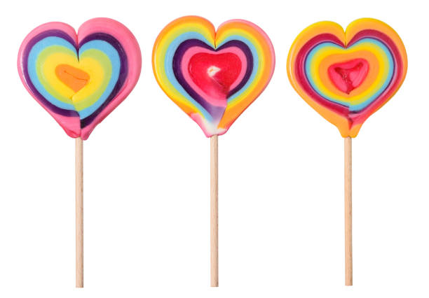 istock Heart shaped lollipop candy set on wooden stick isolated 1399191749