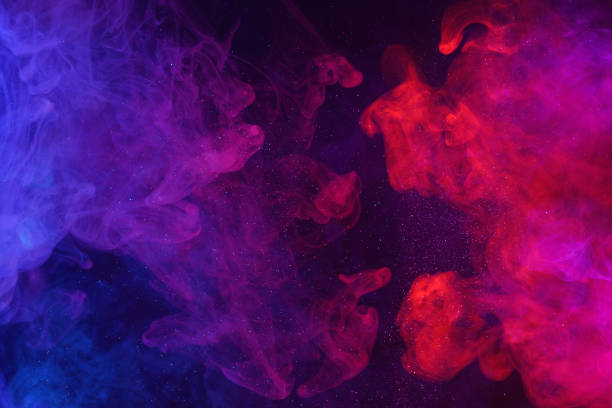 istock Colorful smoke clouds and shiny glitter particles flowing cosmic background 1399191872