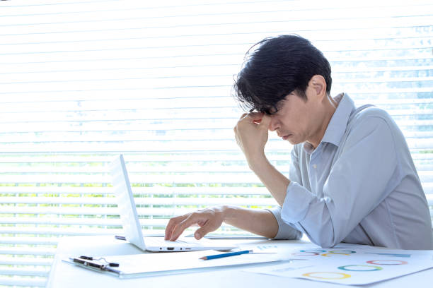 istock a hard-working businessman, middle-aged Asian 1399192078