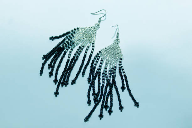 Black silver handmade beaded earrings on a black background