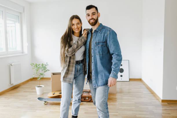 istock Moving day. Young couple moving in new apartment 1399195071