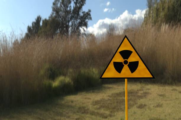 istock Radiation sign on a against the sky and greenery. 1399197116