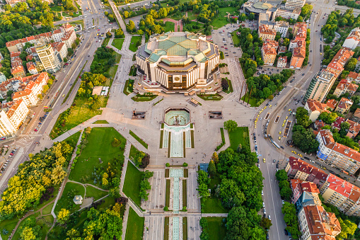 Ultra wide aerial drone shot of national palace of culture in Sofia city downtown district during springtime. The picture was taken near sunset with DJI Phantom 4 Pro drone / quadcopter.