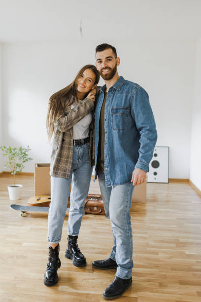 istock Moving day. Young couple moving in new apartment 1399200432