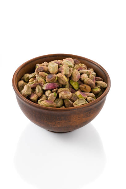istock peeled pistachio in a cup on a white background isolated 1399200782