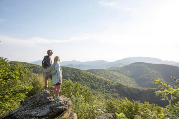 istock Mature hiking couple relax at viewpoint 1399202307