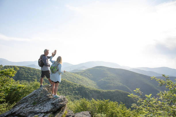 istock Mature hiking couple relax at viewpoint 1399202868