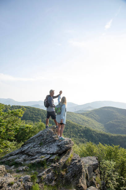 istock Mature hiking couple relax at viewpoint 1399202978