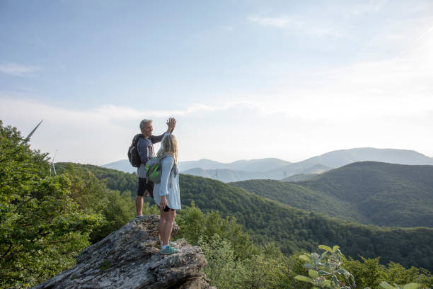 istock Mature hiking couple relax at viewpoint 1399203147