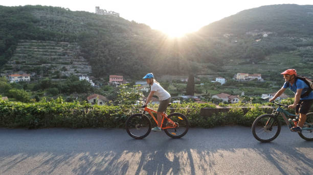 istock Mature couple ride mountain bikes, at sunrise 1399203252