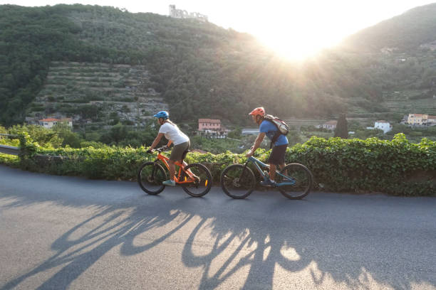 istock Mature couple ride mountain bikes, at sunrise 1399203254