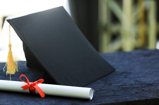Diploma, Cap And Graduation Concept