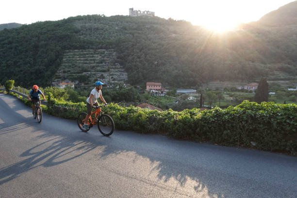 istock Mature couple ride mountain bikes, at sunrise 1399203356
