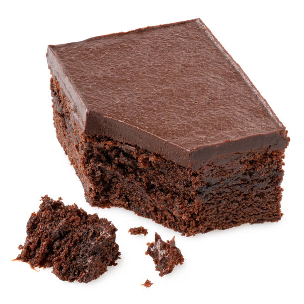 istock Broken chocolate cake square with chocolate icing next to crumbs. 1399203388