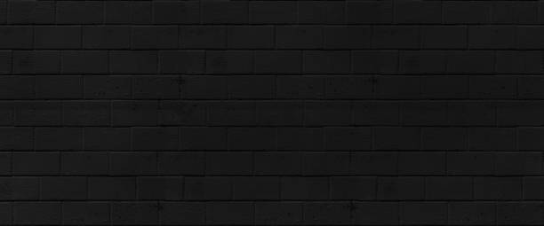 istock Brick black wall texture. background of a old brick house. 1399203894