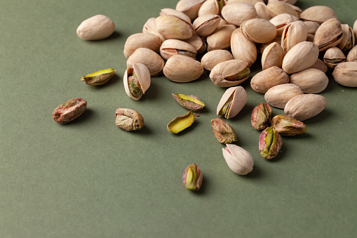 pistachios on  a green background