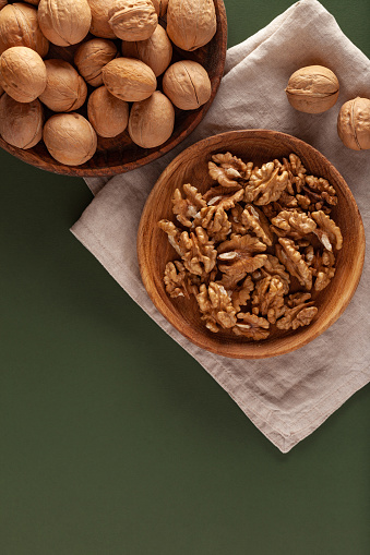 Close-up of walnuts on a green background
