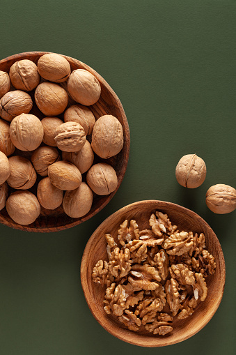 Close-up of walnuts on a green background