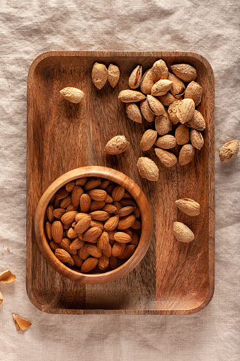 Close-up of almonds in a wooden bowl on the table