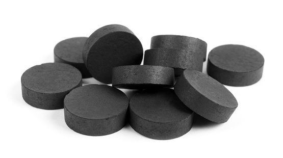 Activated charcoal for intoxication, isolated on white background.