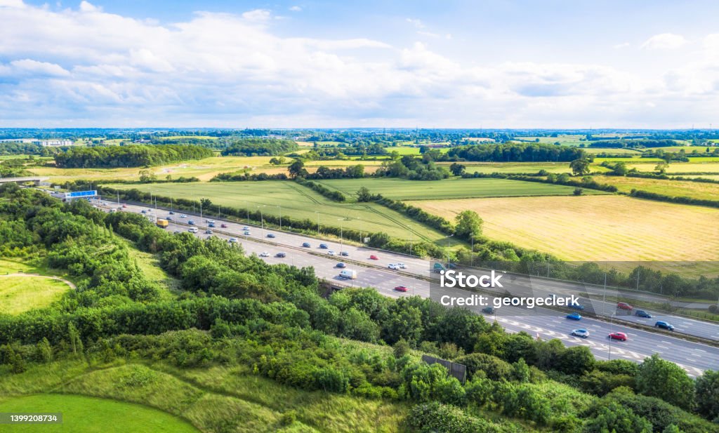 Traffic on the M1 motorway in summer An aerial view of a straight section of the M1 motorway through the English Midlands. UK Stock Photo