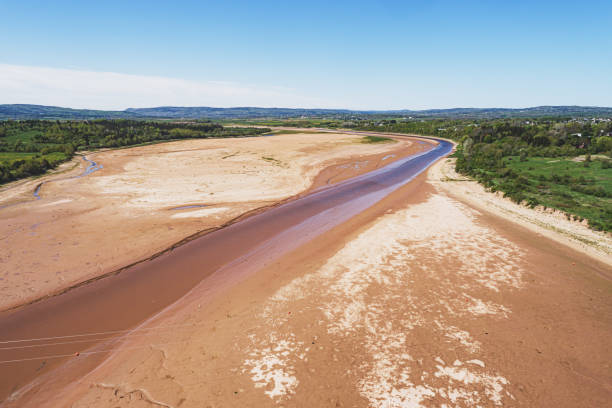 Dry Riverbed Aerial drone view of a river/reservoir that has emptied. dry riverbed stock pictures, royalty-free photos & images