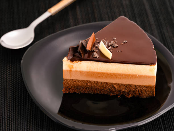 istock A piece of chocolate mousse cake on a black plate. 1399210768