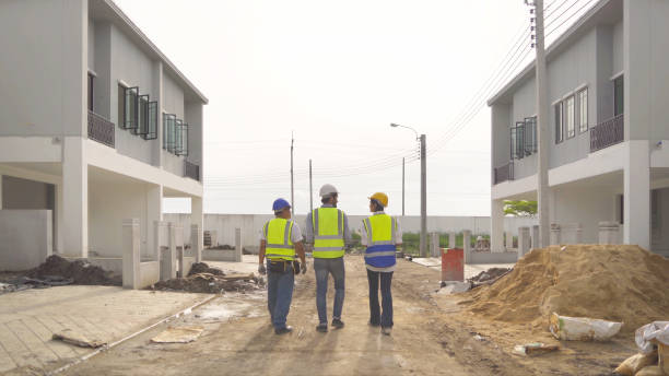 istock A group of workers, a designer team talk, communicate, discuss, and working on industrial construction site at home architecture building project. People lifestyle. 1399211911