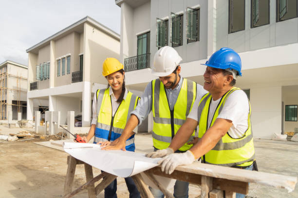 istock A group of workers, a designer team talk, communicate, discuss, and working on industrial construction site at home architecture building project. People lifestyle. 1399211938