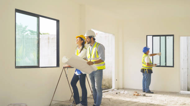 istock A group of workers, a designer team talk, communicate, discuss, and working on industrial construction site at home architecture building project. People lifestyle. 1399212019