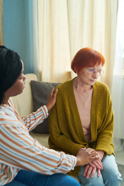 istock Caregiver supporting senior woman in depression 1399215151