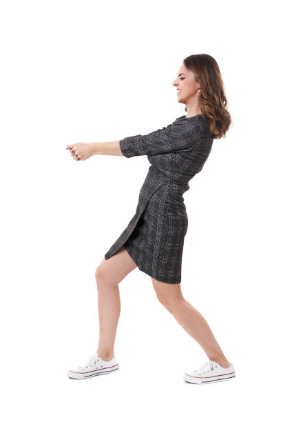 istock Businesswoman pulling an imaginary weight 1399217321