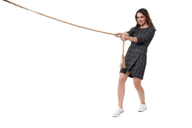 istock Businesswoman pulling an imaginary weight 1399217332