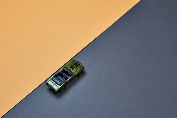 istock Alone micro toy small mini car view on the asphalt road color background 1399218377