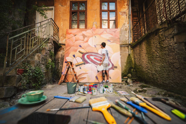 istock Male artist working on a big painting. 1399219906