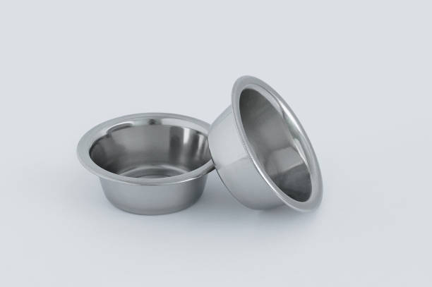 istock Two metal bowls on  white background. 1399225183