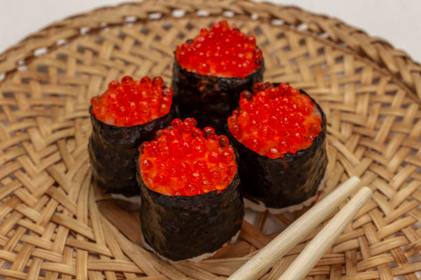 istock Nori maki with caviar and chopsticks on wicker plate. 1399226478