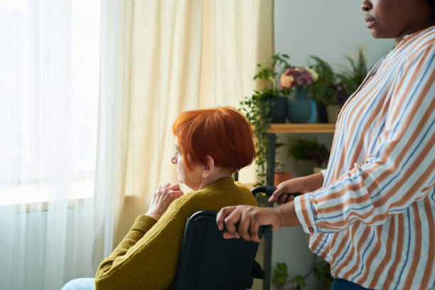 istock Volunteer caring about senior woman 1399227586