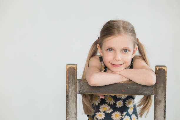 Girl and a very old chair