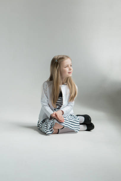 istock Girl sitting on the floor 1399227954